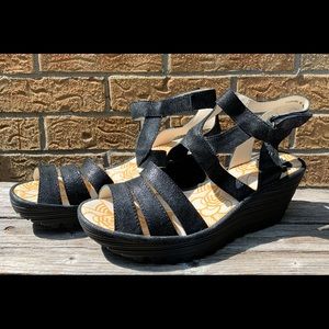 New women’s Fly London sandals, size 10, black leather upper, wedge heels.